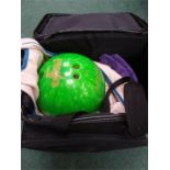 A bowling ball carrier together with a AMF bowling ball and cleaners,shoes.