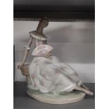 A large Lladro sitting lady with fan.