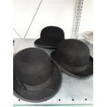 Three black Bowler hats.