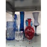 A large quantity of mainly blue coloured glass to include bark effect, bottle,Swedish cut , vases.