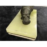 A bronzed Hippo desk blotter on onyx base.