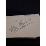 A small green autograph book to include the autographs by Max Bygraves, Michael Ball, Petula