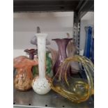 A collection of various coloured glass vases.