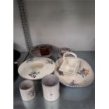 A quantity of traditional pattern Poole Pottery. (9 pieces).
