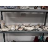 A large quantity of traditional pattern Poole Pottery (29 pieces).