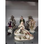 A collection of seven china figurines to include staffs pottery, German cupid ,bocarge , 'The Trusty