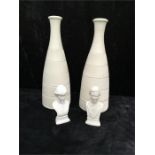 A pair of Poole Pottery Alan White bottle vases and a boxed set of Charles and Diana busts.