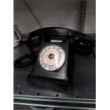 A Vintage black Ericsson Bakelite rotary telephone.