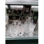 A collection of boxed Edinburgh crystal glass pieces.