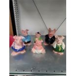 A family of Wade Natwest china pigs to include rare 'Cousin Wesley' pig.