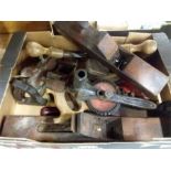 A box of vintage block planes and various hand tools.