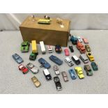 A single wooden filing drawer with an assortment of toy vehicles, including Dinky, Corgi, Matchbox