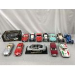 A quantity of unboxed Burago 1/18 scale diecast model cars, together with one boxed example.
