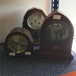 Three various chiming mantle clocks.