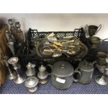 A large collection of cutlery and other metal items.