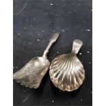 A Victorian silver caddy spoon of engraved leaf form by T & P. Birmingham 1899 together with a