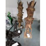 Benin bronze style studies of ancestors and two resin golfers