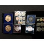 A box of various coins to include commemorative.