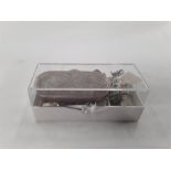 A small box containing some silver pieces. to include a snuff box with engraved decoration