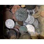 A tin of various coins.