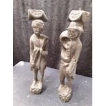 A pair of 17th century or later carved oak corbals of a rural peasant and stone mason.