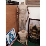 Two unusual mannequin body parts.in wood and cloth wrapeing