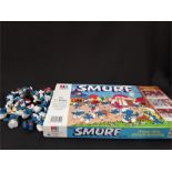 19 Smurf figures and a Smurf game.