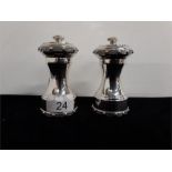 A matching silver pepper mill and salt by Garrard and Co Ltd, Regent Street. 1954 (4" high).