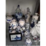 A collection of various pieces of blue and white china. slip ware jug, delft ware plaque, japanese
