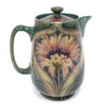 A Moorcroft/Macintyre revived brown Cornflower water jug marked "Macintyre Reg. No. 311908" to base,