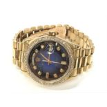 A Gent's 18 Carat Gold and Diamond Rolex Daydate Automatic Wristwatch: blue tone, diamond set