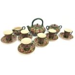A Moorcroft revived brown Cornflower tea service to include six cups and saucers , teapot, lidded