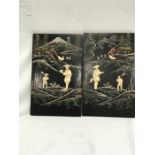 A pair of Japanese lacquered panels depicting Mount Fuji and figures in a river scene inlaid with