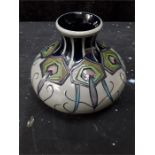 A small modern Moorcroft vase. decorated flowers in the art nouveau style