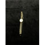 A ladies 9ct gold Longines watch and strap together with extra link and winder.