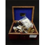 A small box of costume jewellery.