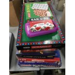 A collection of games, including Meccano and Scrabble