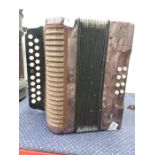A small Hohner accordion.