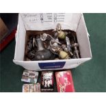 A box containing silver plate and various tins.