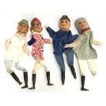 Four German hand puppets with carved wooden heads and legs, and cloth bodies. Height approx. 32cm.