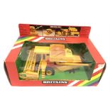 Britains No.9575 New Holland TR85 Combine Harvester, finished in yellow with red detailing and