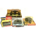 Four Dinky Toys military models: 2 x 691 Striker Anti-Tank Vehicle (one in bubble-pack, the other in