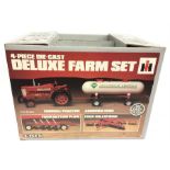 ERTL (USA) Deluxe Farm Set, 1/16 scale four piece die-cast set, comprising Farmall Tractor,