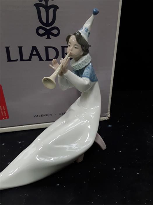 A Lladro figure entitled The Young Jester, boxed.