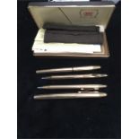 A boxed set of four Cross pens.