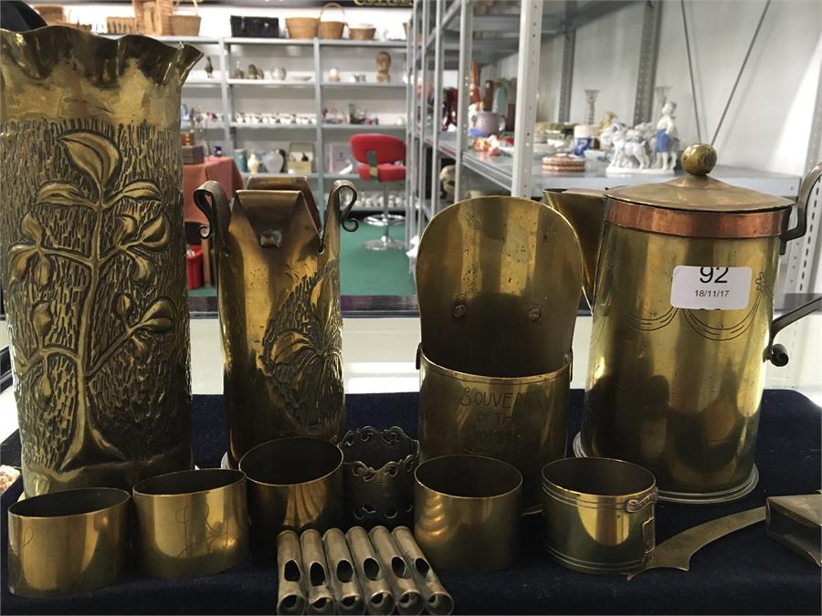 Twelve pieces of Trench Art metal ware to include coffee pot made by POW Lohslein. A vase