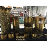 Twelve pieces of Trench Art metal ware to include coffee pot made by POW Lohslein. A vase