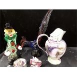 A glass clown, cockerel and three pieces of china.