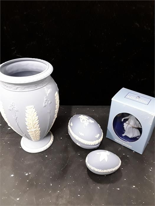 A quantity of blue Wedgwood. to include a vase ,two egg boxes and a dancing figure