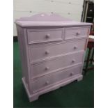 A pine painted chest of five drawers.